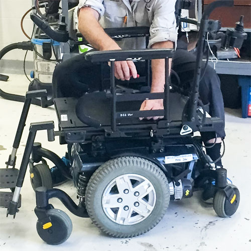 Technicians working on a wheelchair